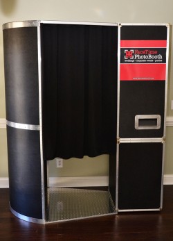 Booth #1: black with brushed aluminum trim; customizable decal on front; 12MP DSLR camera